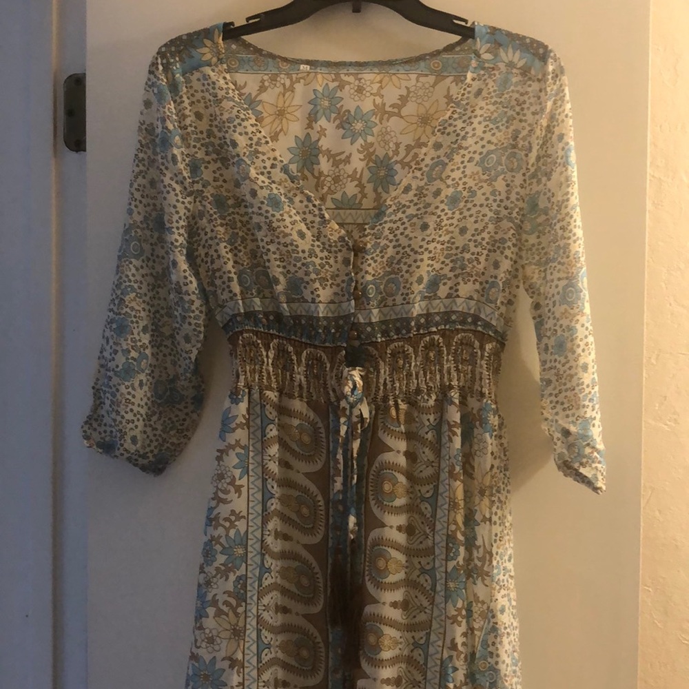 Long sheer design dress. 3/4 sleeves. Button with tie waste